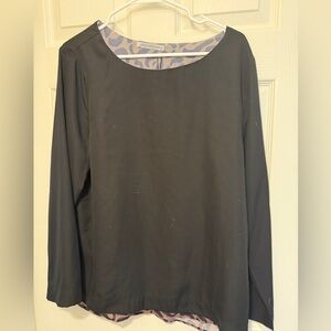 Classy black top with cute leopard peek a boo!